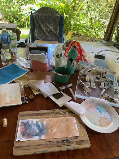 art-painting-on-back-patio-table-art-supplies-explosion-costa-rica-rental-house